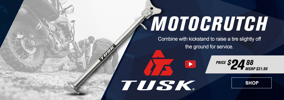 Tusk Motocrutch, Combine with kickstand to raise a tire slightly off the ground for service, video available, $24 amd 88 cents, MSRP $31 and 99 cents, the Motocrutch along with a shot of it being used on a trail while two guys fix a front flat tire, link, shop